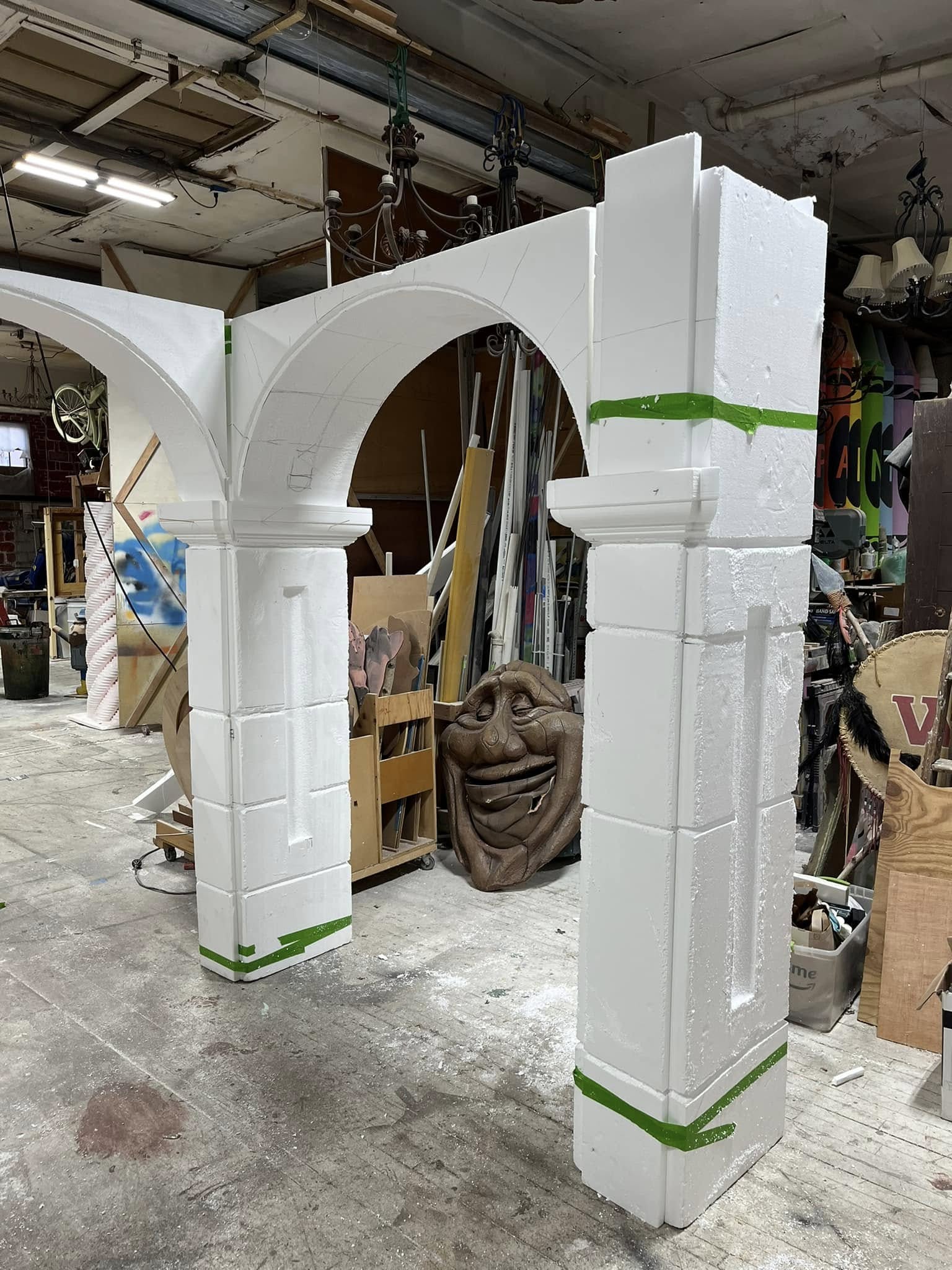 Full-scale custom arch with fluted columns under construction in the shop