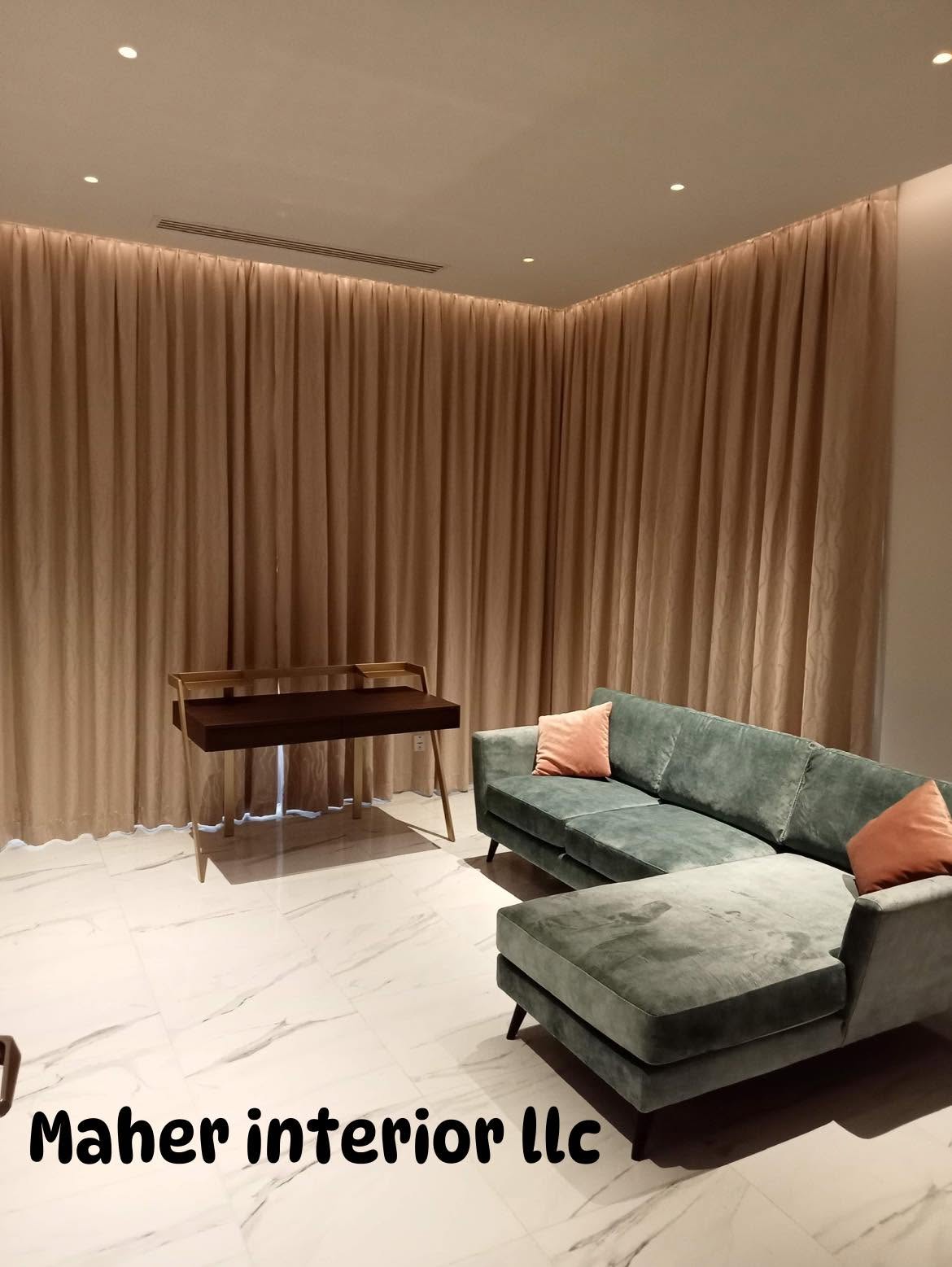 Living room with large-format marble-look porcelain floor and full-height drapery